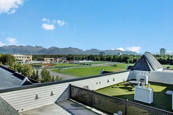 A view from the building showing a playing field and public park Property Image